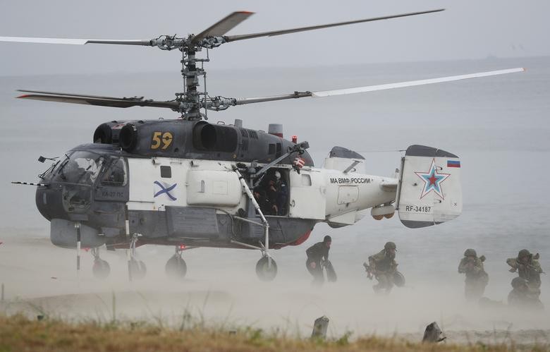 Russian marines disembark from a Kamov Ka-27PS military helicopter during the Ocean Shield 2020 naval exercise at the Khmelevka firing ground on the Baltic Sea coast in Kaliningrad Region, Russia August 3. REUTERS/Vitaly Nevar
